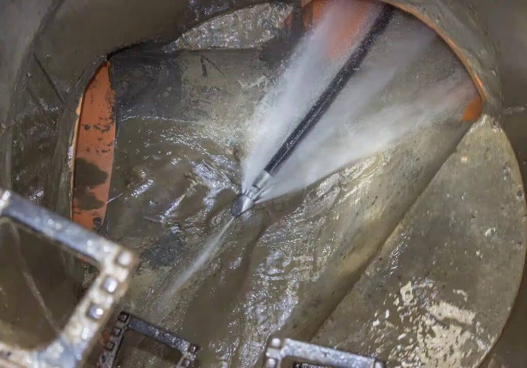 hydro jetting cleaning process removing dirt and debris efficiently.