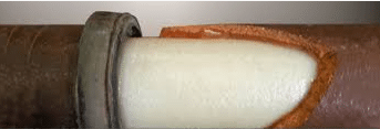 trenchless pipe lining method demonsrtated with closeup of pipe line