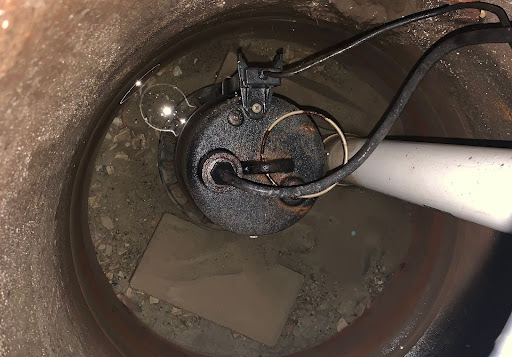 Pump inspection tools inside a water well for maintenance and analysis purposes.