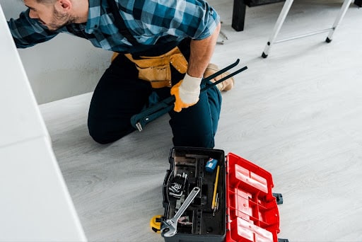 Tips for effective toolbox usage by a technician with tools at hand.
